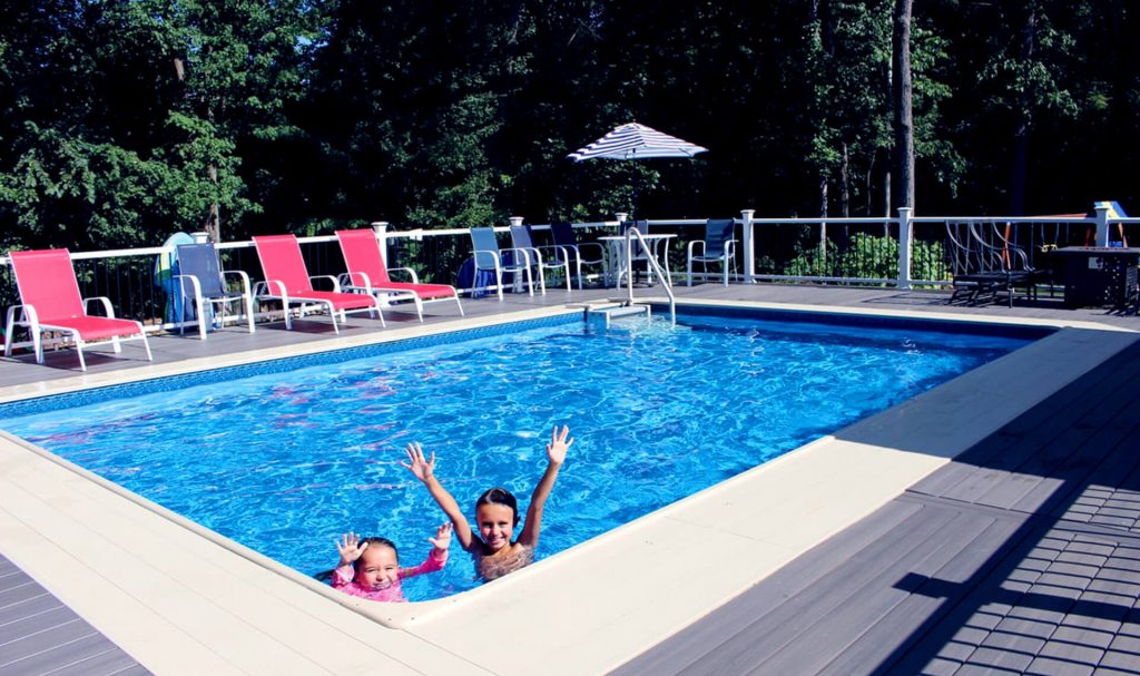 Joyful children in a Gibraltar Backyard Pool area
